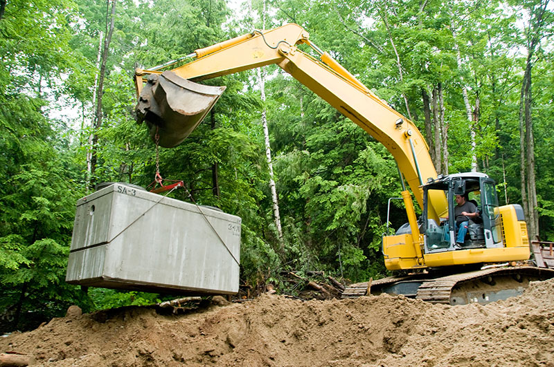 septic installation with excavator